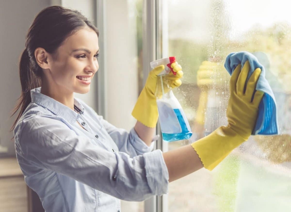 Lady cleaning a window